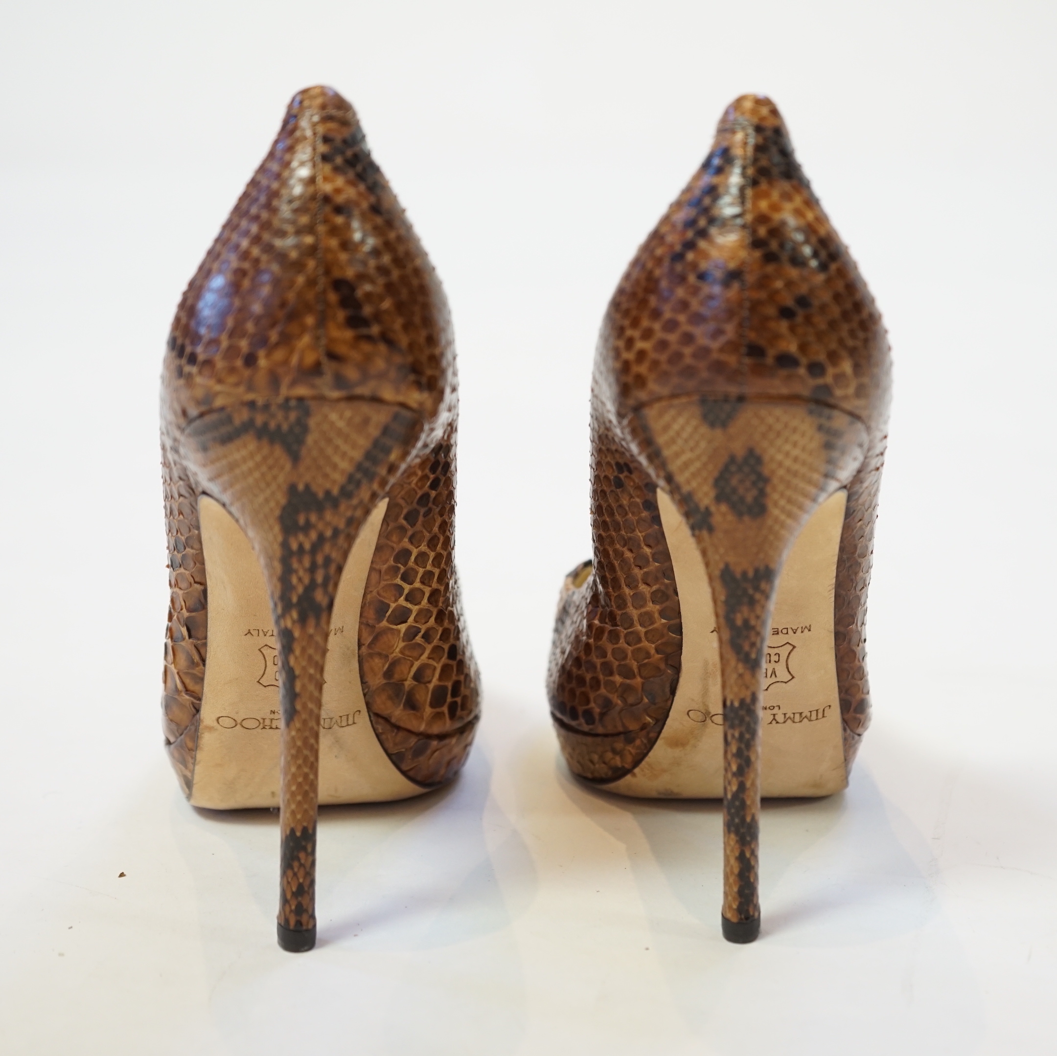 A pair of Jimmy Choo lady's snakeskin platform pumps in brown and black